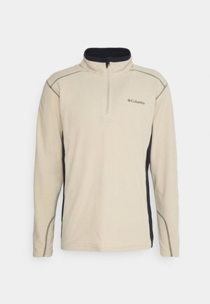 Pullover in fleece beige con un pannello laterale nero, zip quarti davanti e cuciture a contrasto. Presenta un piccolo logo sul petto.