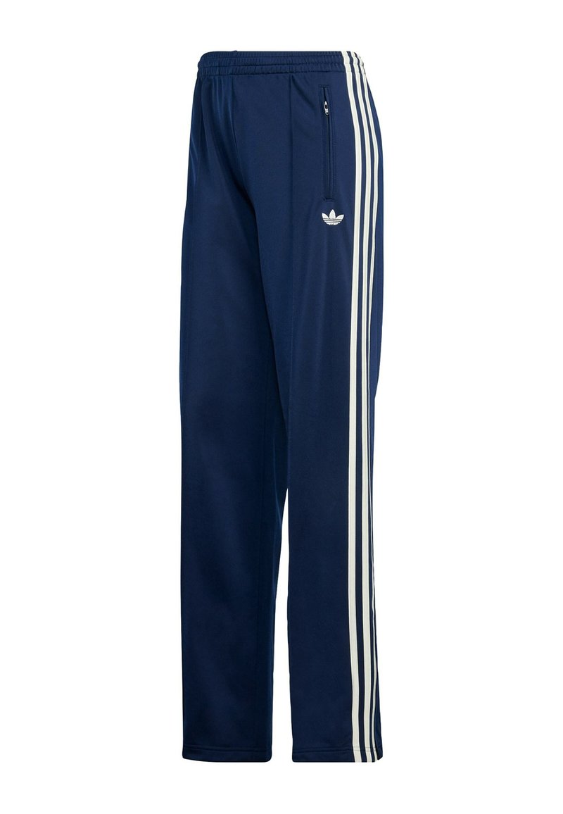 Pantalon de sport bleu marine en tissu lisse et léger, doté de trois bandes blanches latérales et d'une poche zippée sur le côté.