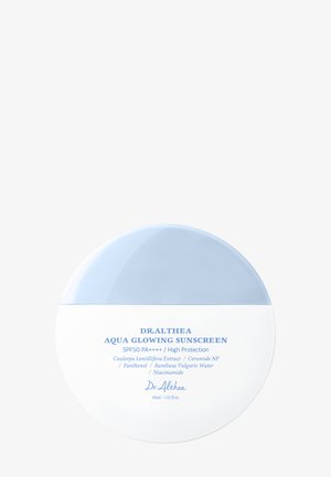 Rund hvit og lyseblå beholder med Dr. Althea Aqua Glowing solkrem med SPF50 PA++++, 45 ml.