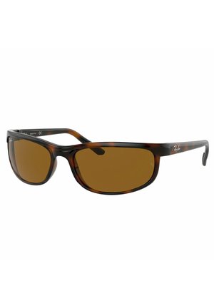 Occhiali da sole tartarugati con lenti marroni, dotati di una montatura in plastica elegante, tempie curve e logo Ray-Ban sul lato.
