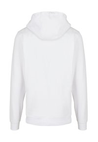 Sudadera blanca con capucha y mangas largas, hecha de un tejido suave. Cuenta con una capucha amplia y puños y dobladillo acanalados. Diseño simple y minimalista.