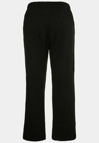Schwarze, locker sitzende Hose mit einem elastischen Bund. Glatte Textur, gerade Beinform, keine sichtbaren Muster oder Hardware-Details.