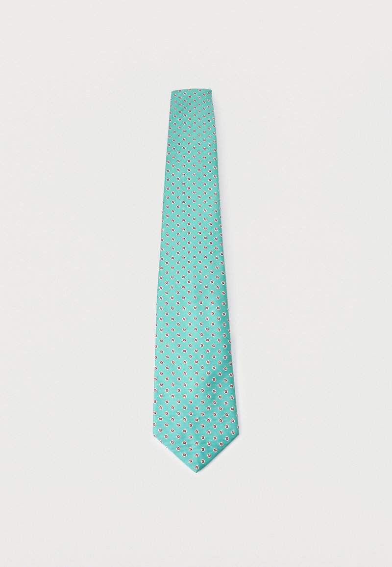 Τιρκουάζ γραβάτα με μικρό λευκό και κόκκινο πουά ανθικό μοτίβο σε απλό ανοιχτό φόντο.