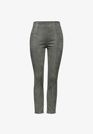 Grüne Faux-Suede-Leggings mit hoher Taille, die über eine gestickte Nahtverarbeitung und eine glatte Textur verfügen. Enganliegendes Design reicht bis zum Knöchel.