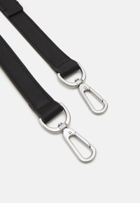 Black leather strap with silver metal hardware and two clips on either end; smooth texture and stitched detailing.