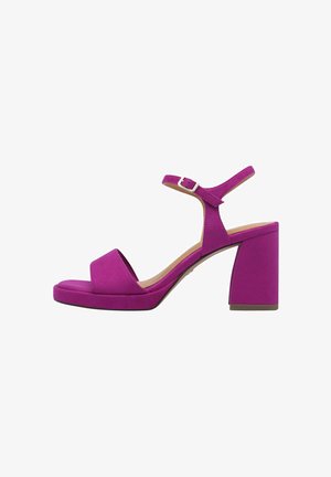 Fuchsia block-heeled sandal with a textured suede finish, open toe, and an adjustable ankle strap featuring a silver buckle.