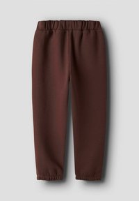 Bruine joggingsbroek van zacht materiaal, met een elastische tailleband, toelopende pijpen en gathered boorden bij de enkels.