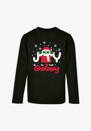 Black long-sleeve shirt featuring a cartoon character in a red Santa hat and scarf, snowflakes, and the text "Joy to the Galaxy" in red.