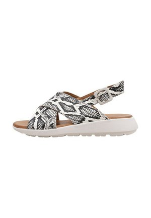 Sandales imprimées serpent noir et blanc avec un design à brides croisées, talon ouvert et boucle réglable. Dotées d'une semelle texturée pour une meilleure adhérence.