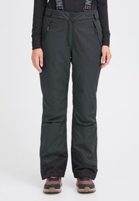 Svarte skibukser laget av slitesterkt stoff, med justerbare stropper, glidelåslommer og forsterkede mansjetter med vannavstøtende design.