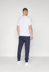 Champion Pantaloni sportivi - dark blue