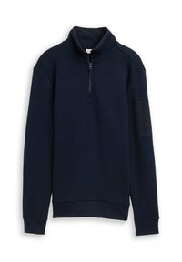 Sudadera de cuello alto en azul marino con un patrón de gofre texturizado, cierre de cremallera de cuarto y puños y dobladillo acanalados. Detalle de bolsillo en la manga izquierda.