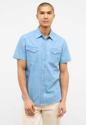 Light blue short-sleeve denim shirt featuring button-up front, two chest pockets, and a straight hem. Smooth texture and classic design.