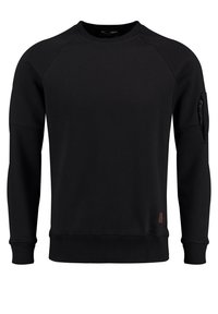 Felpa nera con maniche raglan lunghe, polsi e orlo a coste, tasca con zip sulla manica sinistra e una piccola etichetta logo marrone in basso.