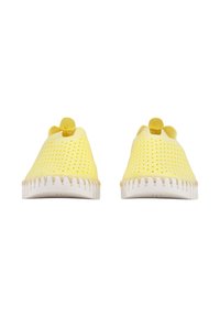 Yellow perforated slip-on shoes with a rounded toe, raised accents at the heel, and white rubber sole featuring textured detailing.