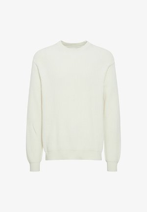 Lys kremfarget ribbestrikket genser med rund hals, lange ermer og tettsittende mansjetter, laget av et mykt stoff med strukturert overflate.