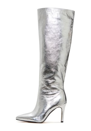 Silver tall stiletto boot with a pointed toe, made of shiny metallic material, featuring a sleek, fitted design and high heel.