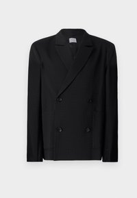 Schwarze doppelte Jacke aus strukturiertem Stoff mit Spitzenrevers, zwei vorderen Taschen und zwei schwarzen Knöpfen auf jeder Seite.