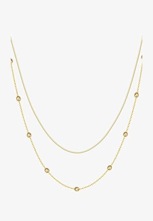 Podwójny złoty naszyjnik z gładkimi kulistymi koralikami, z cienkim, płaskim łańcuszkiem oraz delikatnym okrągłym łańcuszkiem. Metaliczny połysk.