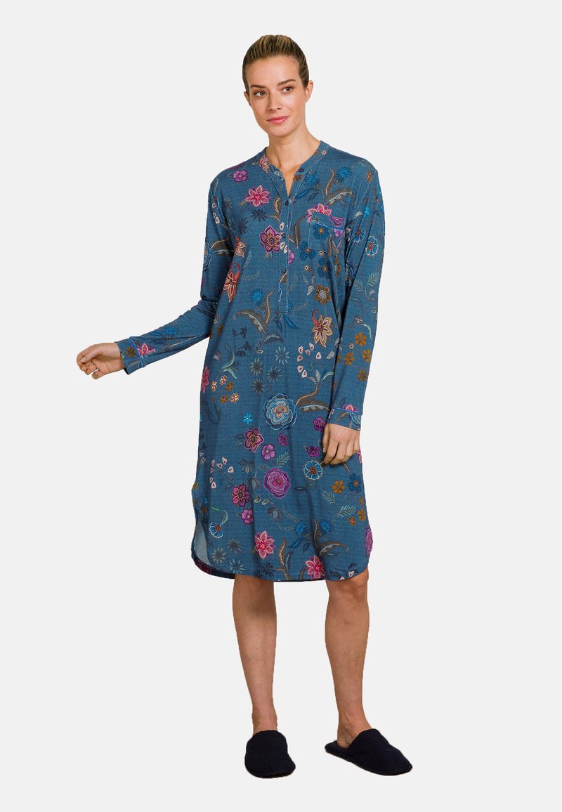 Floral-printed long-sleeve dress in blue fabric, with a buttoned neckline, side slits, and a relaxed fit. Non-slip black slipper shoes.
