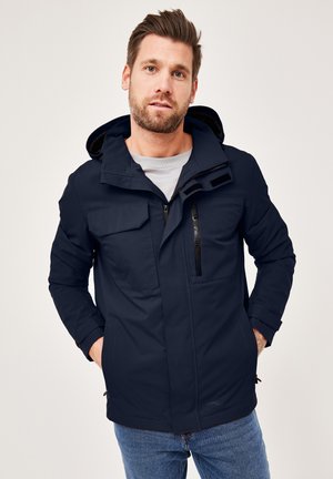 Navy waterproof jacket with a hood, zippered front, and multiple pockets. Features a textured fabric and adjustable cuffs for fit.