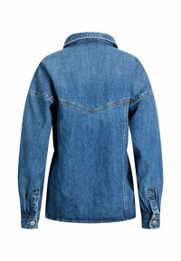 Denim jacket in blue, featuring a pointed collar, long sleeves, and button cuffs. Back design includes a yoke and prominent stitching detail.