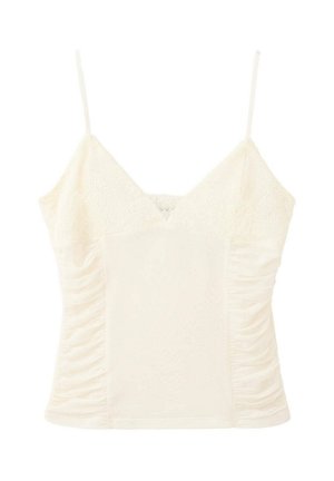 Camisola sin mangas de encaje color crema con tirantes finos y costados fruncidos, diseñada para un ajuste ceñido y femenino.