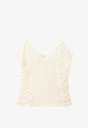 Caraco en dentelle sans manches couleur crème avec fines bretelles et côtés froncés, conçu pour une coupe près du corps et féminine.