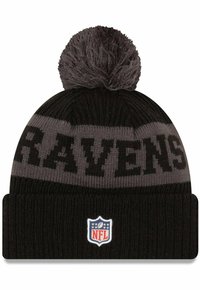 Black knit beanie with a gray stripe, featuring "RAVENS" in black lettering. Includes a gray pom-pom on top and an NFL logo patch on the cuff.