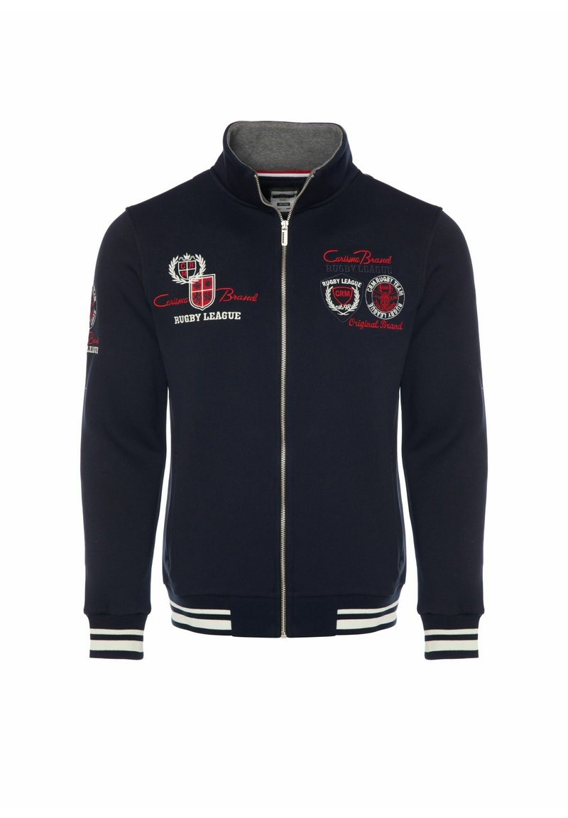 Giacca zip-up blu navy, con polsini e orlo a costine, loghi ricamati in rosso e bianco, e una morbida fodera interna. Design casual e atletico.