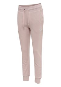 Hellrosa zulaufende Jogginghose mit elastischem Bund, Kordelzug, Seitentaschen, gerippten Bündchen und kleinem weißem Logo am linken Oberschenkel.