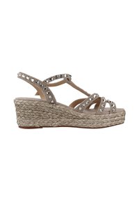 Sandali con tacco a cuneo beige con tacco in juta intrecciata e brillanti dettagli in strass sulle cinghie. Design open toe e più cinghie incrociate.