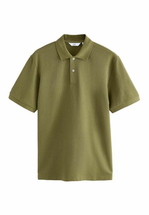 Olive green polo shirt made from textured fabric, featuring a classic collar, two buttons, and short sleeves. Minimalist design with no patterns.