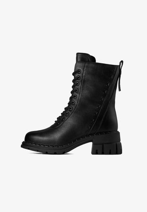 Black ankle boot with a textured leather surface, lace-up front, and a block heel. Side features decorative hardware accents.