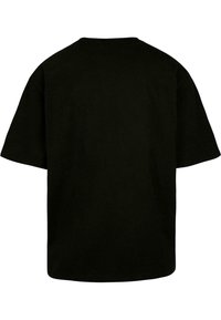 Sort bomulds T-shirt med afslappet pasform, korte ærmer og rund halsudskæring. Glat tekstur, ingen synlige logoer eller mønstre. Bagsidebillede.