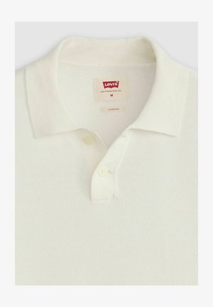 Witte polo met korte mouwen in een gestructureerde stof, met een klassieke kraag, een placket met twee knopen en een Levi's label. Maat M.