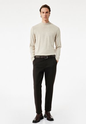 Stickad tröja - beige