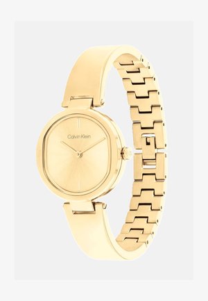 Zlatni sat Calvin Klein s okruglim sunčevo-svjetlućim brojčanikom i povezanom metalnom narukvicom, s sjajnim završetkom i minimalističkim akcentima.