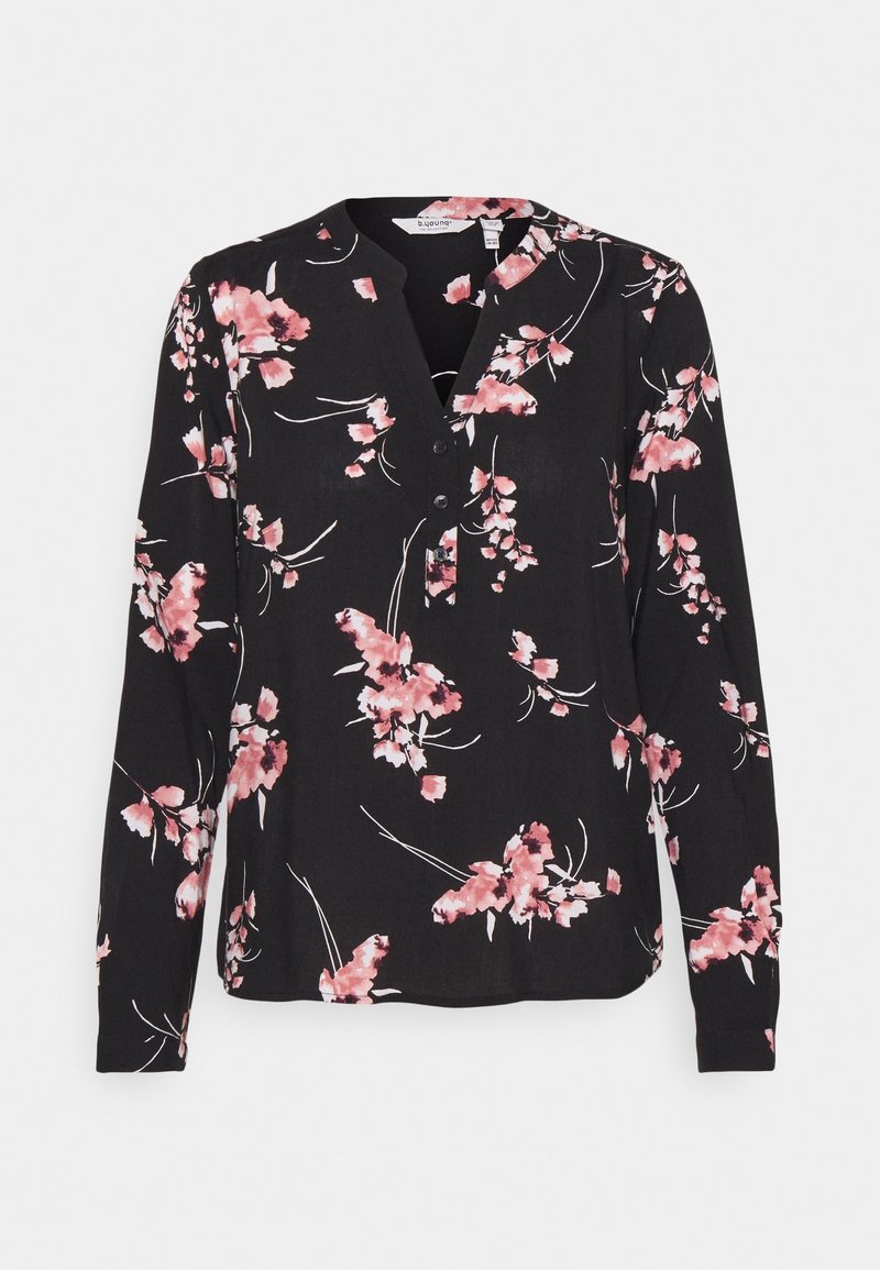 Blouse noire à manches longues avec imprimés floraux roses et blancs, col en V avec trois boutons et coupe ample.