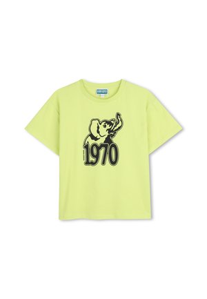 Limoengroene katoenen T-shirt met een zwarte olifantafbeelding en de tekst "1970" eronder, voorzien van korte mouwen en een losse pasvorm.