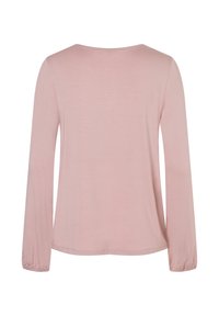 Langärmliges Oberteil aus weichem rosa Stoff mit lockerer Passform, runder Ausschnitt und elastischen Bündchen. Glatte Textur, keine sichtbaren Muster.