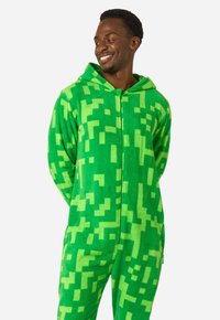 Green fleece onesie featuring a pixelated square pattern in varying shades of green, with a hood and front zipper for closure.