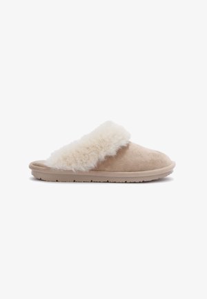 Beige suede slipper with a fluffy cream fur cuff, rounded shape, and a flexible sole featuring textured grip details.