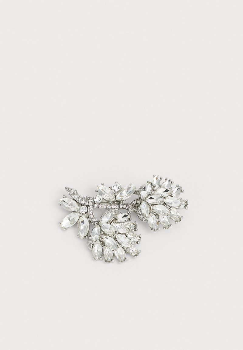 Rhinestone brooch featuring an intricate design with marquise and round cut clear crystals set in silver-toned metal, resembling floral branches.