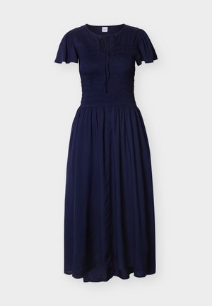 Robe midi bleu marine avec manches courtes évasées, corsage smocké, encolure ronde avec lien, et jupe fluide plissée.