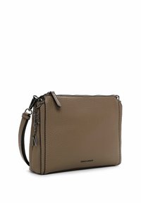 Rectangular beige leather crossbody bag with a textured surface, silver hardware, and a detachable charm featuring an "N" detail.