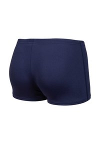 Marinblå badbyxor i slim fit med platta sömmar, designade för en snug passform och komfortabelt bärande.