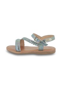 Sandales à brides avec finition irisée métallisée, semelle intérieure beige et boucle réglable à la cheville. Semelle plate et design de bride tressée.