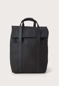 Black waterproof backpack with a roll-top design, two adjustable straps, and a smooth texture. Features a simple, minimalistic aesthetic.