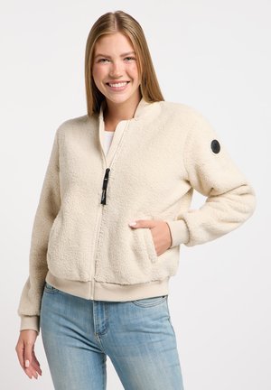 Beige fleece bomberjack met een rits aan de voorkant, geribbelde manchetten en tailleband. Voorzien van zijzakken en een rond zwart logo op de mouw.